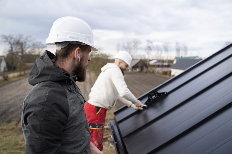 two men working on gutters