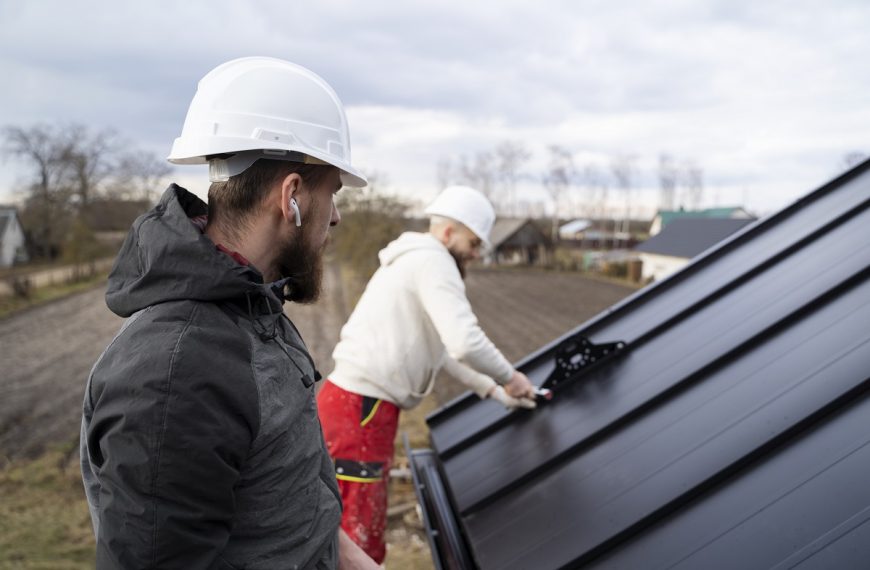 two men working on gutters